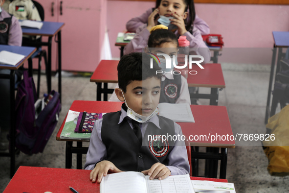 Palestinian students attend a class at a private school in Gaza City, on March 6, 2022. 