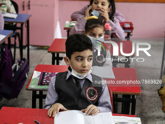 Palestinian students attend a class at a private school in Gaza City, on March 6, 2022. (