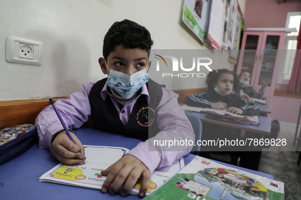 Palestinian students attend a class at a private school in Gaza City, on March 6, 2022. 