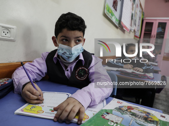 Palestinian students attend a class at a private school in Gaza City, on March 6, 2022. (