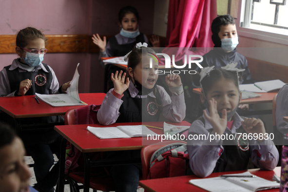 Palestinian students attend a class at a private school in Gaza City, on March 6, 2022. 