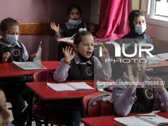 Palestinian students attend a class at a private school in Gaza City, on March 6, 2022. (