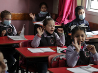 Palestinian students attend a class at a private school in Gaza City, on March 6, 2022. (