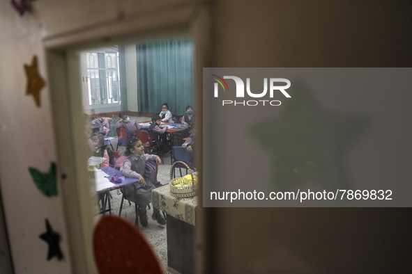 Palestinian students attend a class at a private school in Gaza City, on March 6, 2022. 