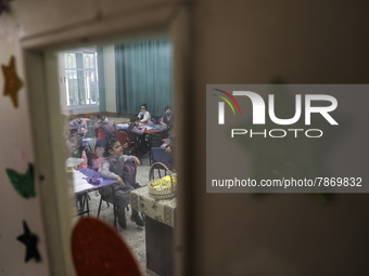 Palestinian students attend a class at a private school in Gaza City, on March 6, 2022. (