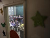 Palestinian students attend a class at a private school in Gaza City, on March 6, 2022. (