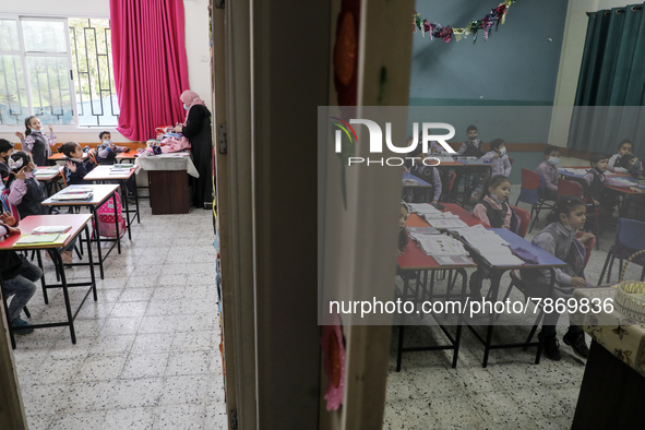 Palestinian students attend a class at a private school in Gaza City, on March 6, 2022. 