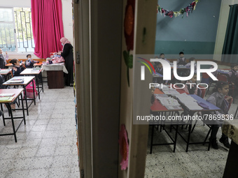 Palestinian students attend a class at a private school in Gaza City, on March 6, 2022. (