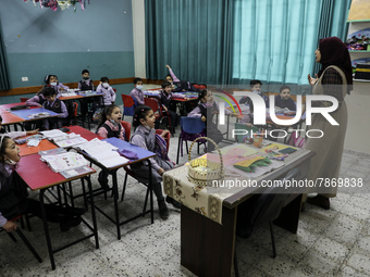 Palestinian students attend a class at a private school in Gaza City, on March 6, 2022. (