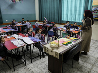 Palestinian students attend a class at a private school in Gaza City, on March 6, 2022. (