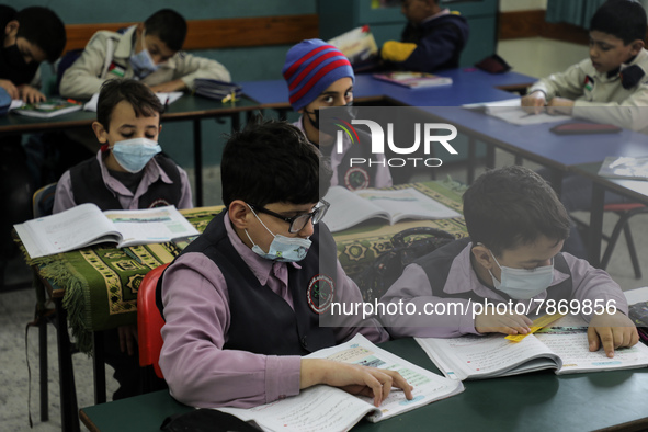 Palestinian students attend a class at a private school in Gaza City, on March 6, 2022. 