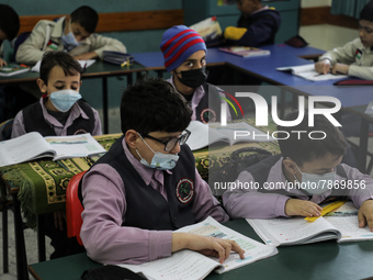 Palestinian students attend a class at a private school in Gaza City, on March 6, 2022. (