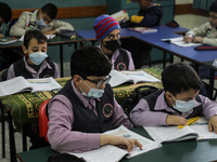 Palestinian students attend a class at a private school in Gaza City, on March 6, 2022. (