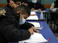 Palestinian students attend a class at a private school in Gaza City, on March 6, 2022. (