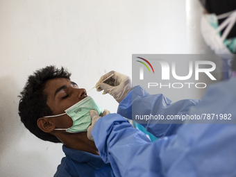 Rohingya refugees gets a coronavirus test at temporary shelter in Alue Buya Pasie village after strandet on a beach in Bireuen regency, Aceh...