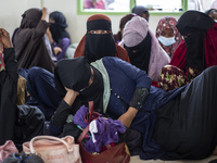 Rohingya refugees take a rest at temporary shelter in Alue Buya Pasie village after strandet on a beach in Bireuen regency, Aceh province on...