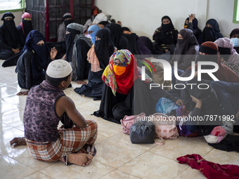 Rohingya refugees take a rest at temporary shelter in Alue Buya Pasie village after strandet on a beach in Bireuen regency, Aceh province on...