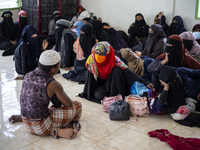 Rohingya refugees take a rest at temporary shelter in Alue Buya Pasie village after strandet on a beach in Bireuen regency, Aceh province on...