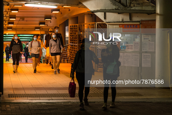 Expats come out from a ferry at the Central Piers, in Hong Kong, China, on March 6, 2022.  