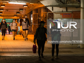 Expats come out from a ferry at the Central Piers, in Hong Kong, China, on March 6, 2022.  (