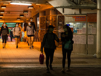 Expats come out from a ferry at the Central Piers, in Hong Kong, China, on March 6, 2022.  (