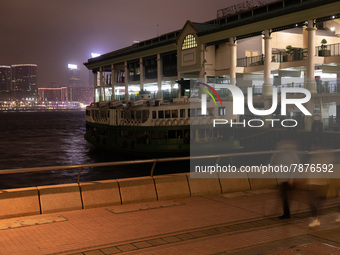 A Star Ferry is moored at Central Piers. The emblematic cross-harbour ferry line had to reduce its service frequency because of the pandemic...