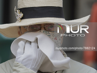 A passer-by in Mexico City's Zócalo during the change to green epidemiological traffic light after recording a decrease in hospital occupanc...