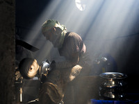 Worker works in dust environment inside in a utensil factory while sunrays enter through the rooftop in Dhaka, Bangladesh on March 08, 2022....