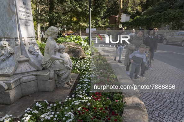 People are seen walking near a monument in the surroundings of a street in Sintra. 28 February 2022. According to the General Health Directi...