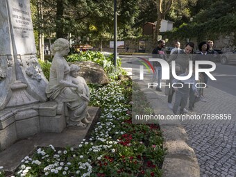 People are seen walking near a monument in the surroundings of a street in Sintra. 28 February 2022. According to the General Health Directi...