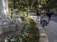 People are seen walking near a monument in the surroundings of a street in Sintra. 28 February 2022. According to the General Health Directi...