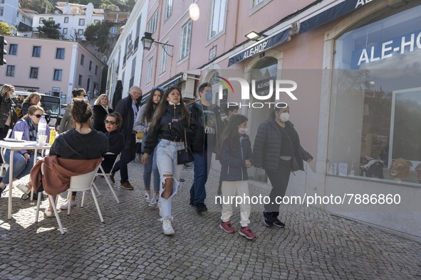 People wearing protective masks are seen walking around the historic center of Sintra. 28 February 2022. According to the General Health Dir...