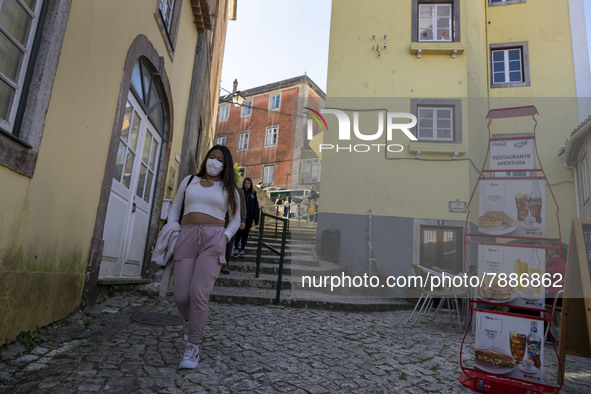 People wearing protective masks are seen walking around the historic center of Sintra. 28 February 2022. According to the General Health Dir...