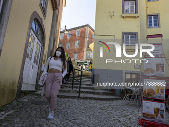 People wearing protective masks are seen walking around the historic center of Sintra. 28 February 2022. According to the General Health Dir...