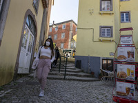 People wearing protective masks are seen walking around the historic center of Sintra. 28 February 2022. According to the General Health Dir...