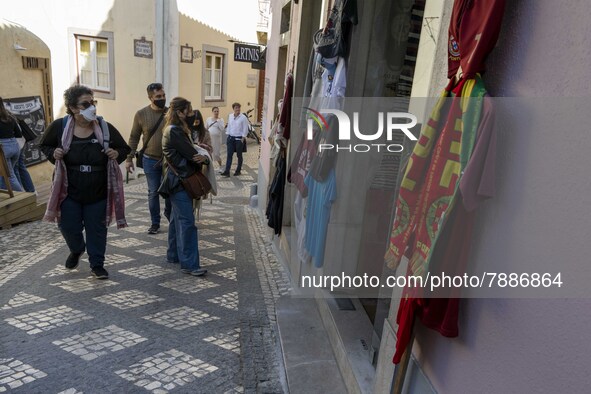 People wearing protective masks are seen walking around the historic center of Sintra. 28 February 2022. According to the General Health Dir...