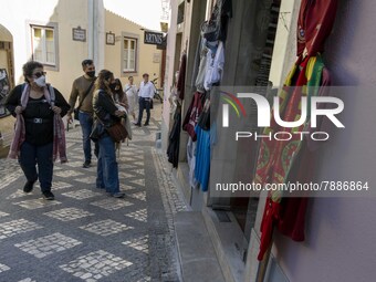 People wearing protective masks are seen walking around the historic center of Sintra. 28 February 2022. According to the General Health Dir...