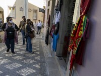 People wearing protective masks are seen walking around the historic center of Sintra. 28 February 2022. According to the General Health Dir...