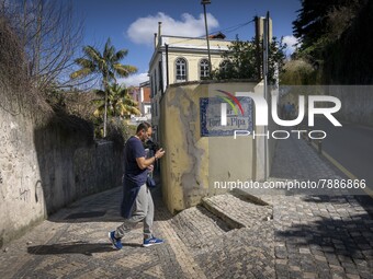 A person is seen walking around the historic centre of Sintra. 28 February 2022. According to the General Health Direction (DSG) bulletin, s...