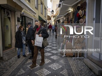 People wearing protective masks are seen walking around the historic center of Sintra. 28 February 2022. According to the General Health Dir...