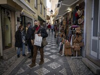 People wearing protective masks are seen walking around the historic center of Sintra. 28 February 2022. According to the General Health Dir...