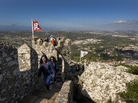 People walk around the Moorish Castle located in the historic centre of Sintra. 28 February 2022. According to the General Health Direction...