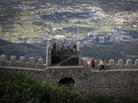 People walk around the Moorish Castle located in the historic centre of Sintra. 28 February 2022. According to the General Health Direction...