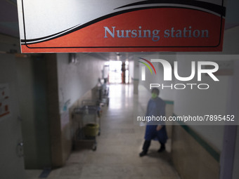 An Iranian nurse wearing a protective suit walks along a corridor at a COVID-19 ward in a children hospital in the holy city of Qom 145Km (9...