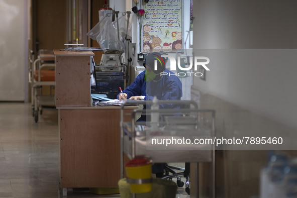 An Iranian nurse wearing a protective suit works at a COVID-19 ward in a children hospital in the holy city of Qom 145Km (90 miles) south of...