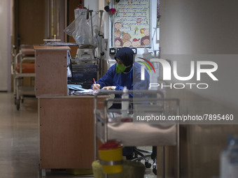 An Iranian nurse wearing a protective suit works at a COVID-19 ward in a children hospital in the holy city of Qom 145Km (90 miles) south of...