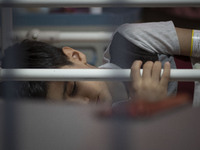 An Iranian 9-year-old boy who is infected by COVID-19 lies on a hospital bed at a new coronavirus disease ward in a children hospital in the...