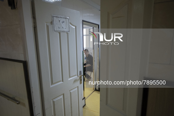 An Iranian man who is infected by COVID-19 looks on as he sits at a room in a COVID-19 ward in a hospital in the holy city of Qom 145Km (90...