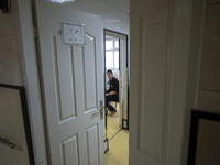 An Iranian man who is infected by COVID-19 looks on as he sits at a room in a COVID-19 ward in a hospital in the holy city of Qom 145Km (90...