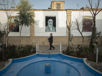 An Iranian man prays while visiting the house of Ayatollah Ruhollah Khomeini, founder and first spiritual leader of the Islamic Republic of...